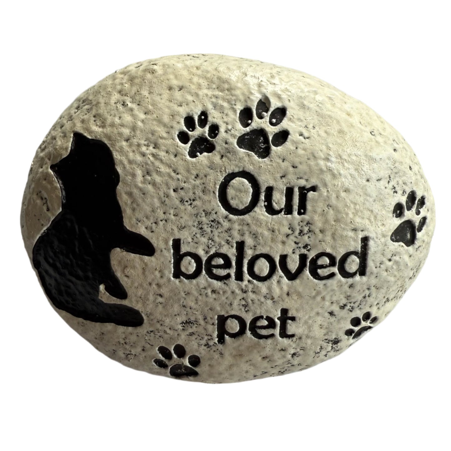 3.5" x 3" oval stone, painted white with black cat, paw prints and message that reads Our beloved pet