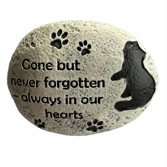 3.5" x 3" oval stone, painted white with black cat, paw prints and message that reads Gone but never forgotten – always in our hearts