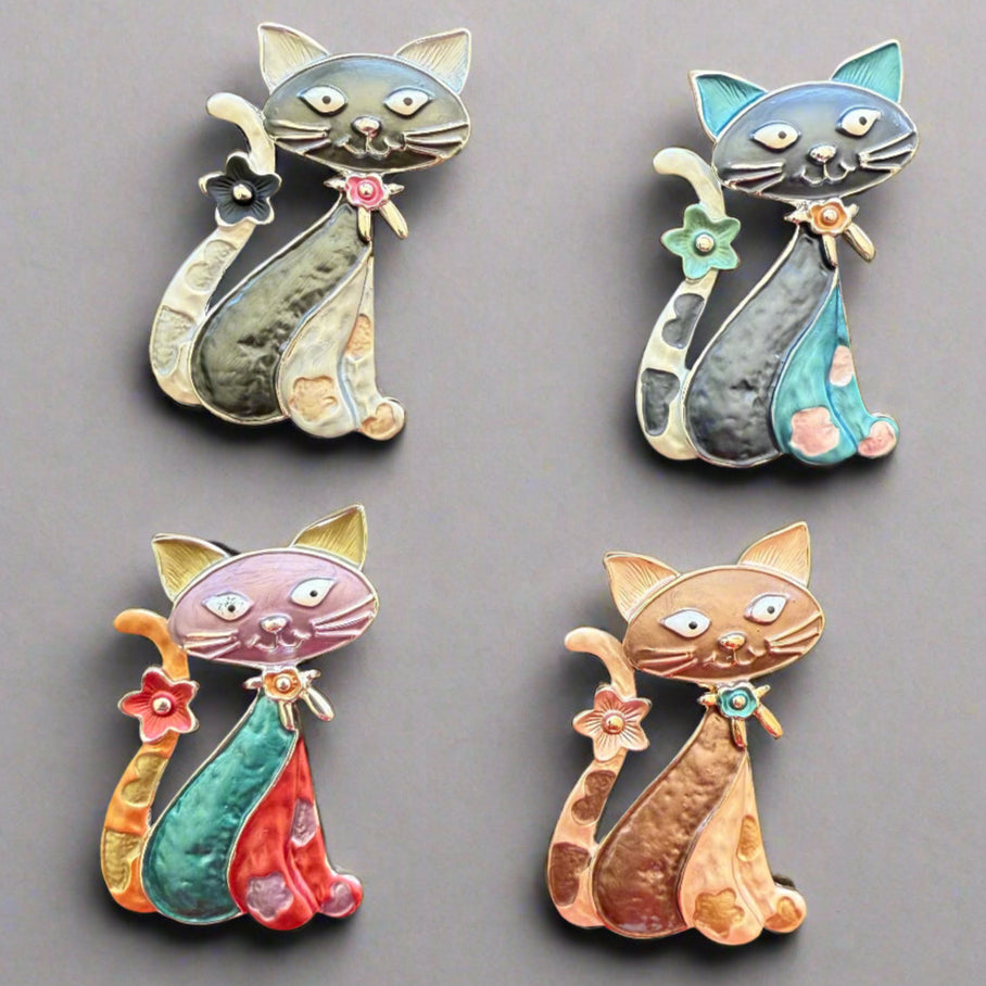 Magnetic Cat Brooch showing all available colours: blue, black/gold, multicolour and bronze