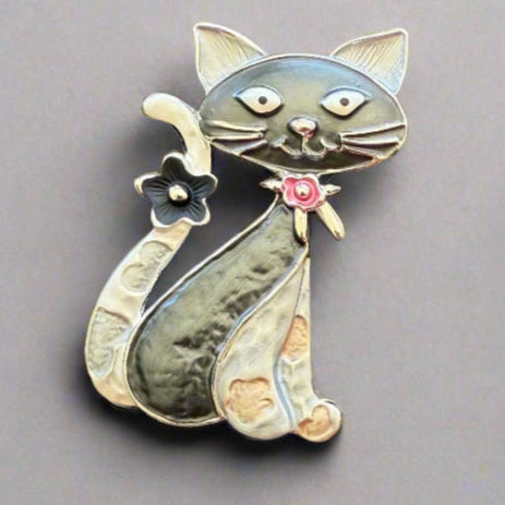 Magnetic Cat Brooch with very strong magnetic – no pins required – for easy placement and damage free removal. Purrrfect addition to brighten up coat, cardigans, ponchos or fixing a wrap or scarf. It is beautiful on hat and bags too, not thicker than 3  – 4 mm and makes a very nice gift for many occasions. Available in blue, black/gold, multicolour and bronze