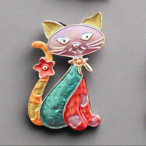 Magnetic Cat Brooch with very strong magnetic – no pins required – for easy placement and damage free removal. Purrrfect addition to brighten up coat, cardigans, ponchos or fixing a wrap or scarf. It is beautiful on hat and bags too, not thicker than 3  – 4 mm and makes a very nice gift for many occasions. Available in blue, black/gold, multicolour and bronze