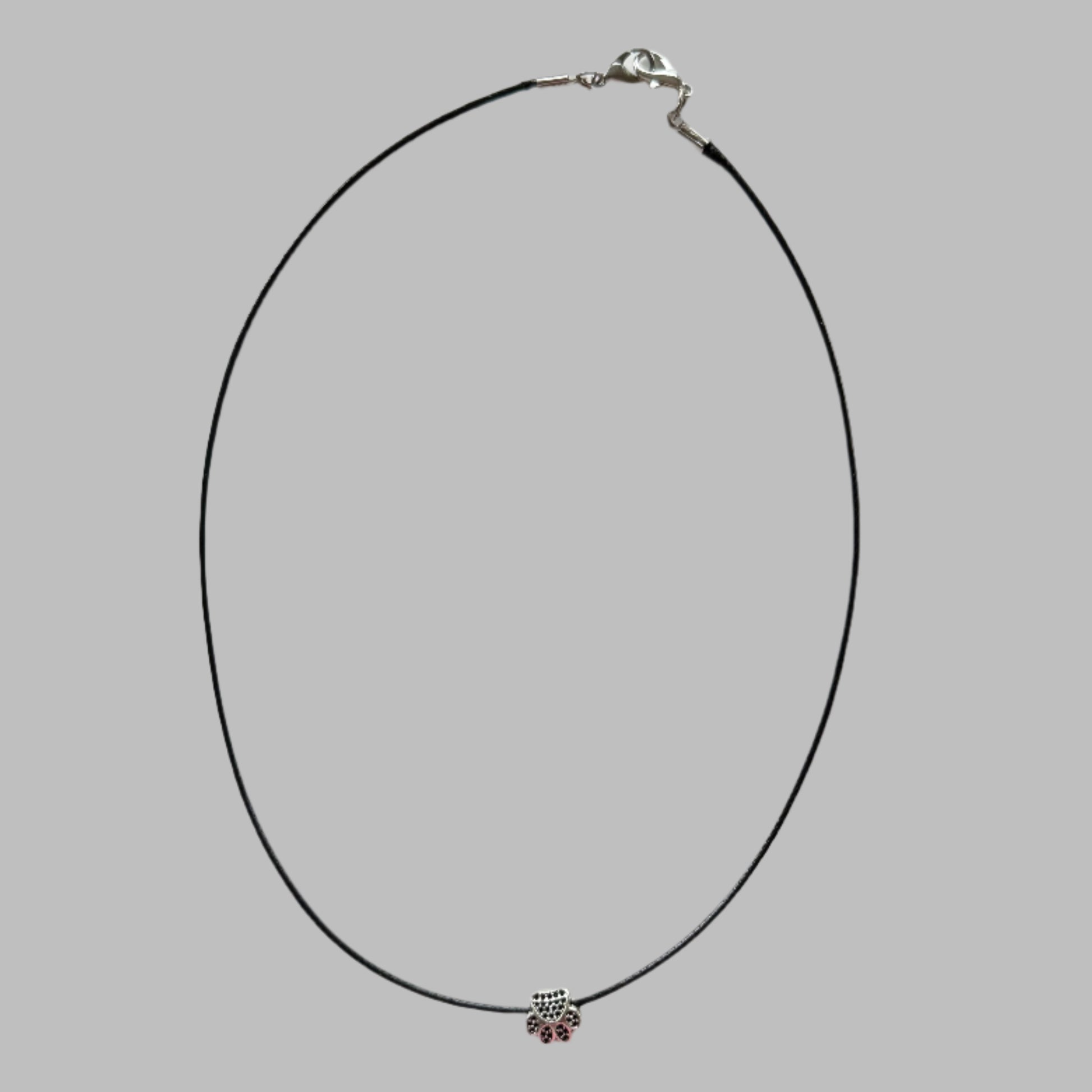 cute silver paw print bead on waxed cord necklace full view