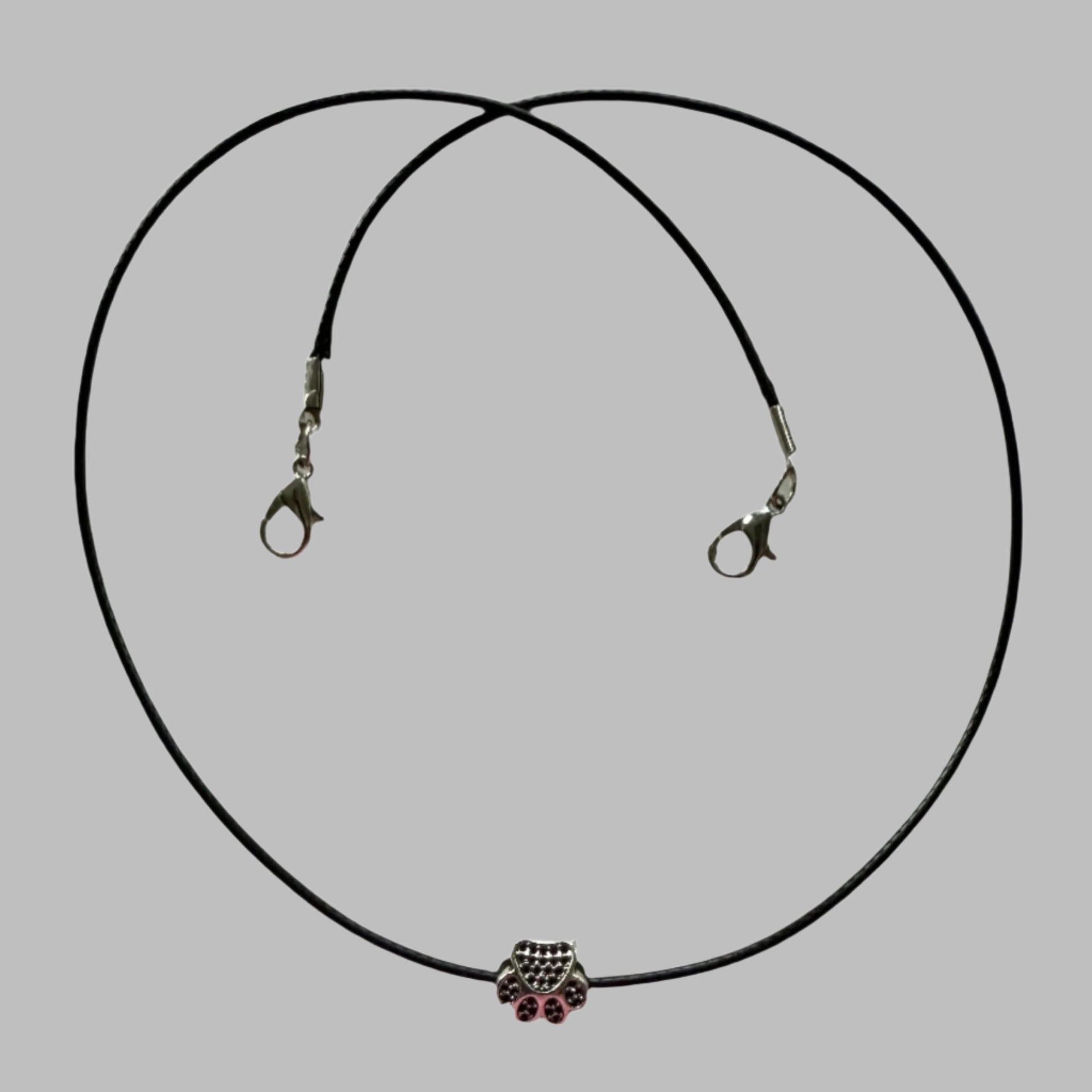cute silver metal paw print bead on waxed cord with double lobster claw clasps, hypoallergenic metal