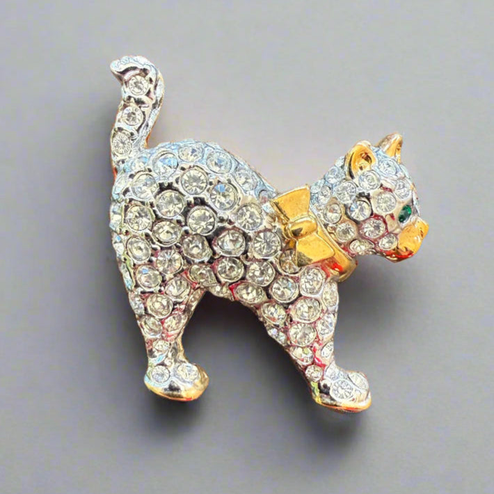 super cute staff favourite rhinestone cat broo, great size at under an 1" in diameter, with cute de-tails like gold ears and bow ties