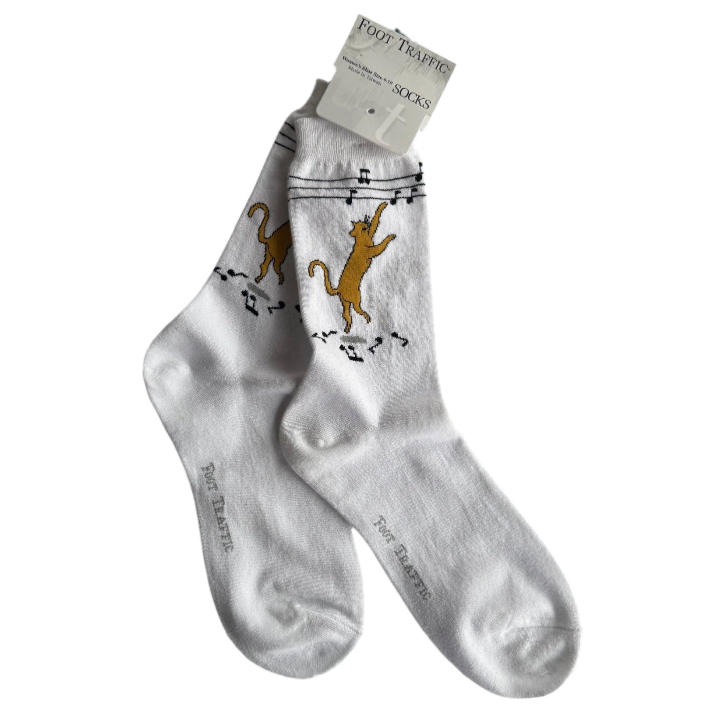 white socks with super cute ginger cat dancing and pawing at music notes