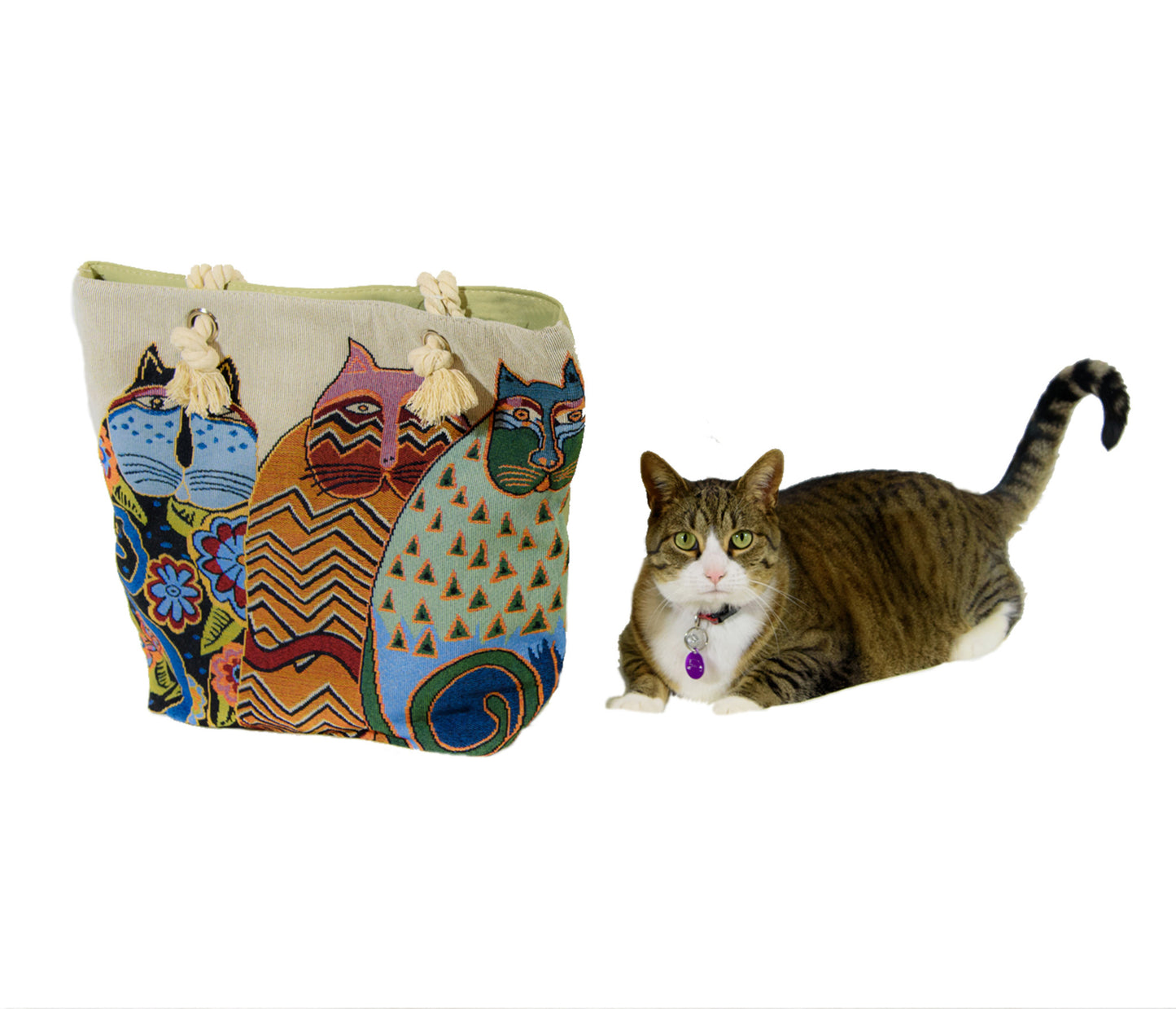 Cute cat in photo (smile) sitting beside 3 iconic Laurel Burch cats on one side of the bag, sage green on the back. Sturdy and well-made with inside pocket. Measures 17” x 14”.