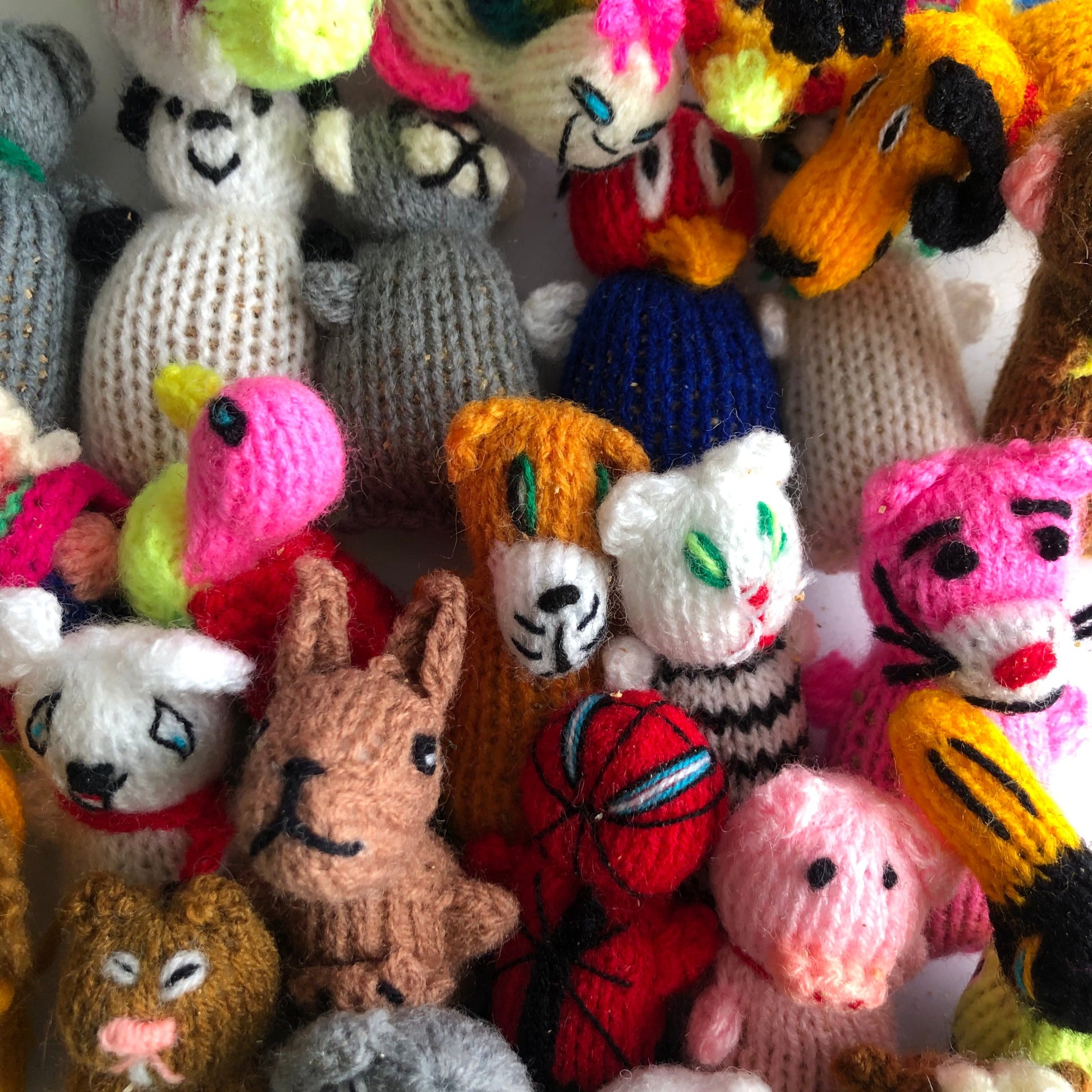 cute little handmade knit character cat toys filled with a mixture of Honeysuckle wood and organic catnip, 3" long