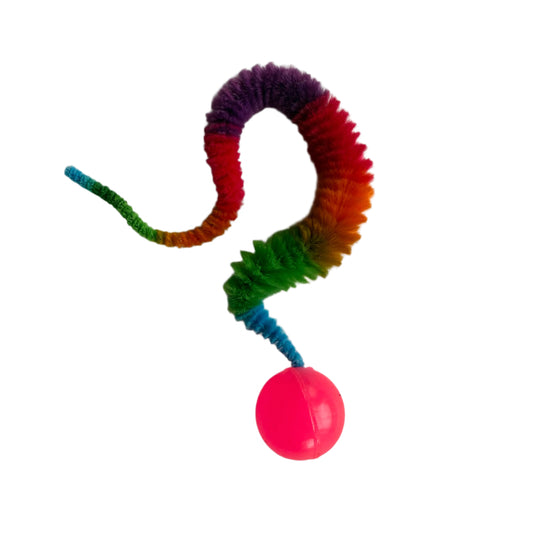 8" velour "tail" in rainbow colours and attached to a compressed rubber super bouncy ball
