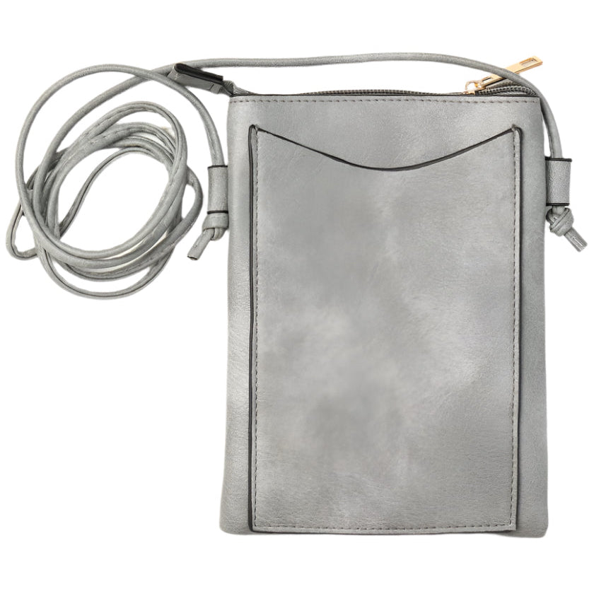 cross body cel phone bag with paw prints on the front and shown here with pocket on the back
