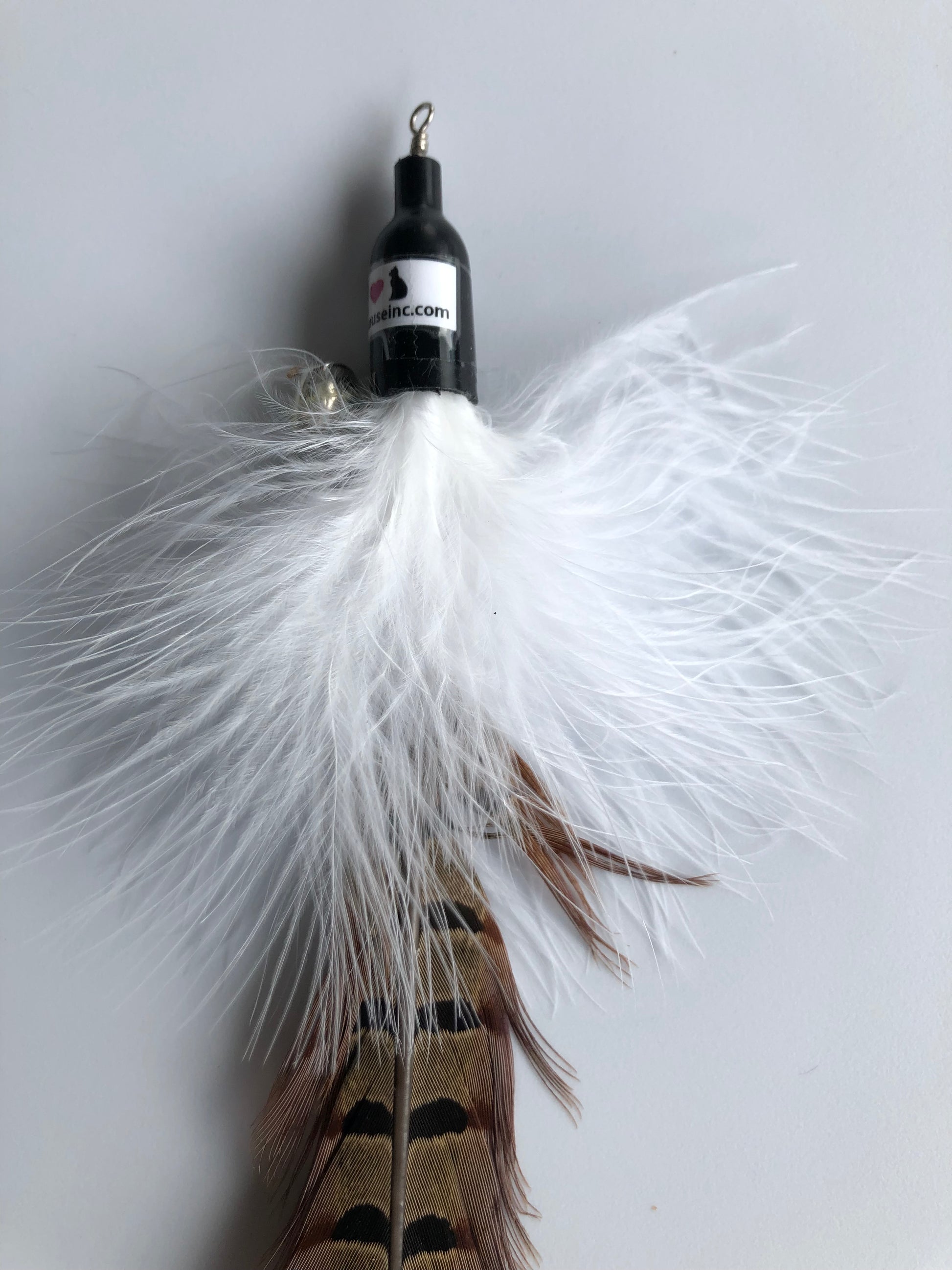 closeup of handmade pheasant feather attachment for wand or fishing rod, approx. 8"