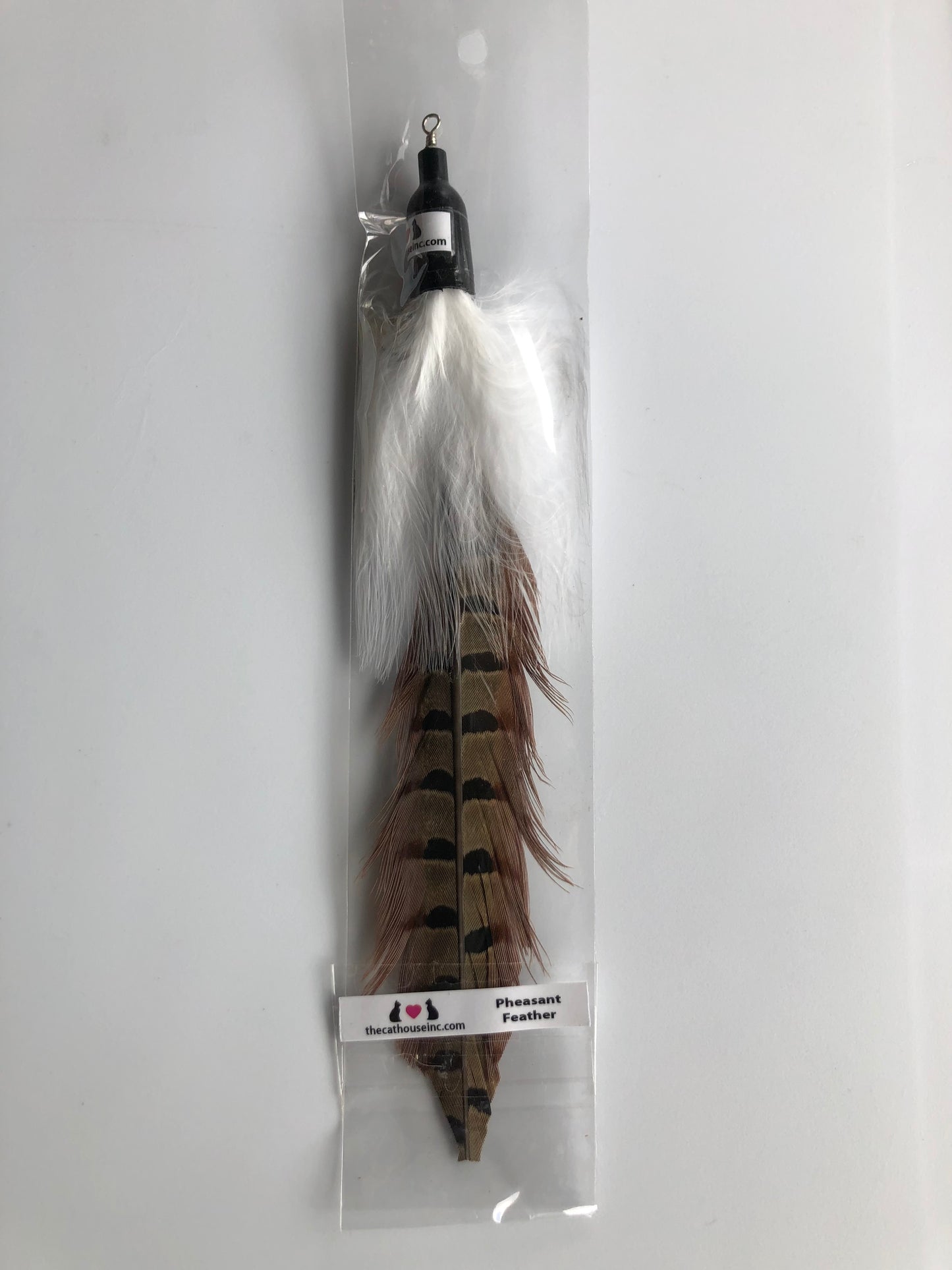 handmade pheasant feather attachment for wand or fishing rod, approx. 8", shown in packaging