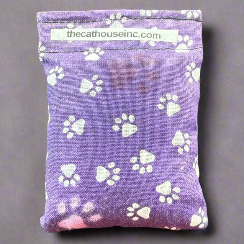closeup of single refillable bag 3.5" x 2.5", catnip and honeysuckle been, velcro closure, variety of prints