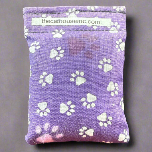 closeup of single refillable bag 3.5" x 2.5", catnip and honeysuckle been, velcro closure, variety of prints