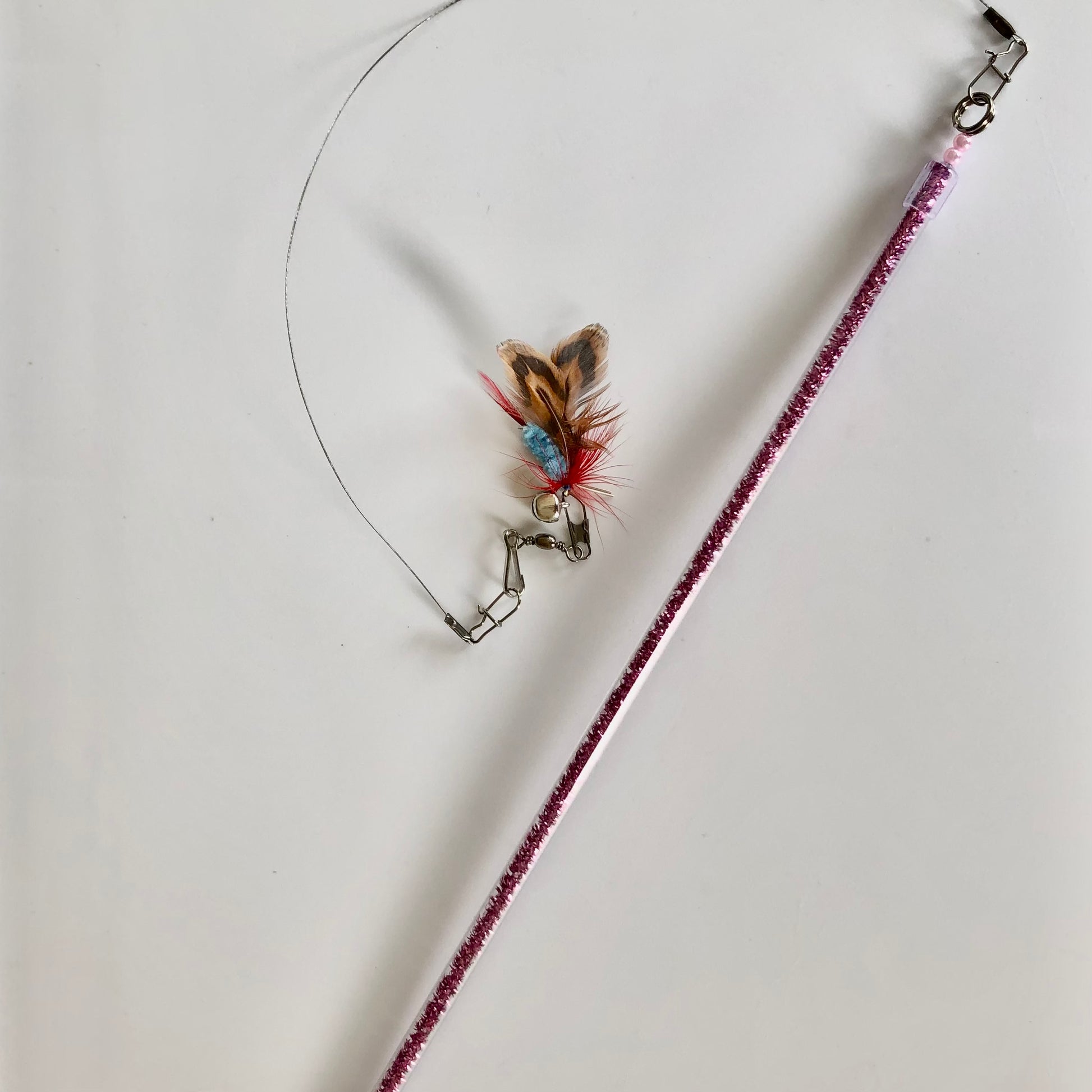 telescopic mini-wand with 11" pink glitter handle that extends another 10", with closeup of bonus fly fishing cat toy